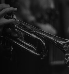 trumpet being played in dark club